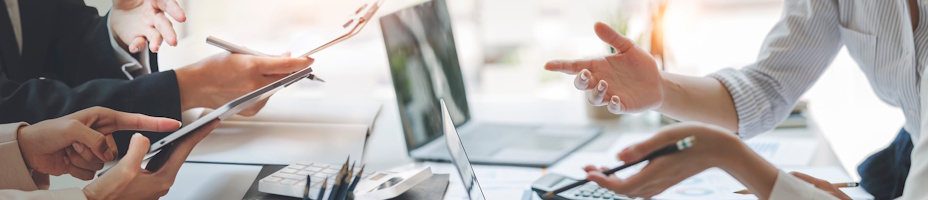 Office workers having a meeting around a business table